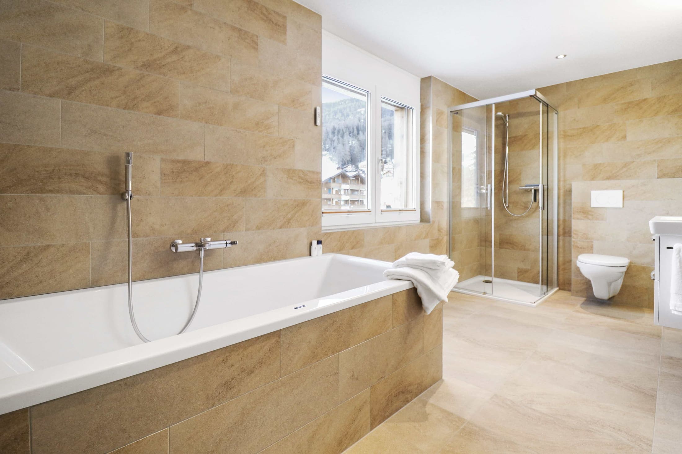 Second bathroom with bathtub and glass shower